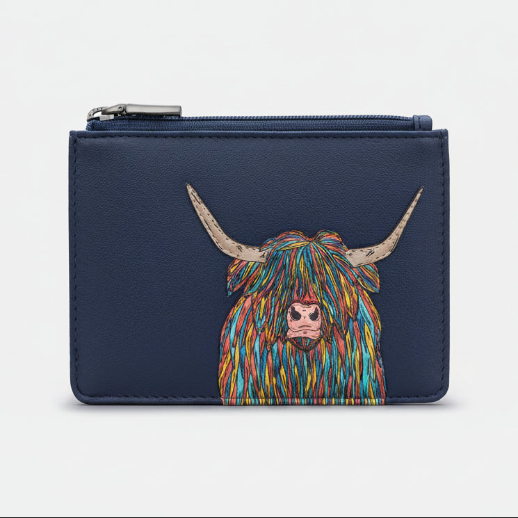 Highland cow zip-top purse in navy vegan leather, front view on grey