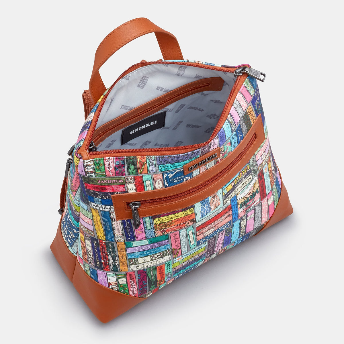 Jane Austen Library Backpack in book spine print, tan trim, angled view