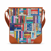 Jane Austen Library Maxi Cross Body Bag in book spine print, tan trim, front view on grey