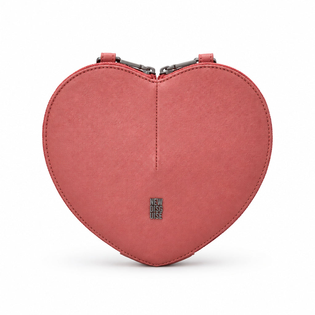 Love Lane Heart Cross Body Bag in rose pink, front view on grey