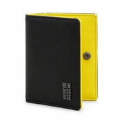 Nolan Card Holder in black and yellow, front view on grey