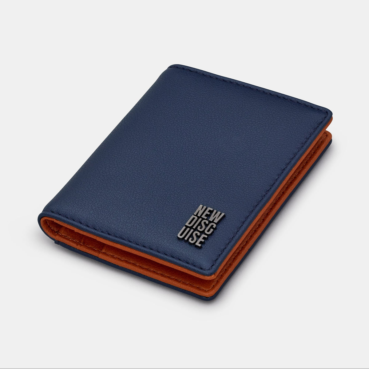 Nolan Card Holder in navy and tan, angled view
