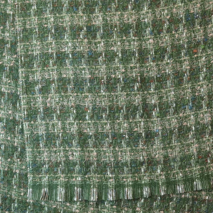 Close-up of the forest green and ecru check weave with fringed edge