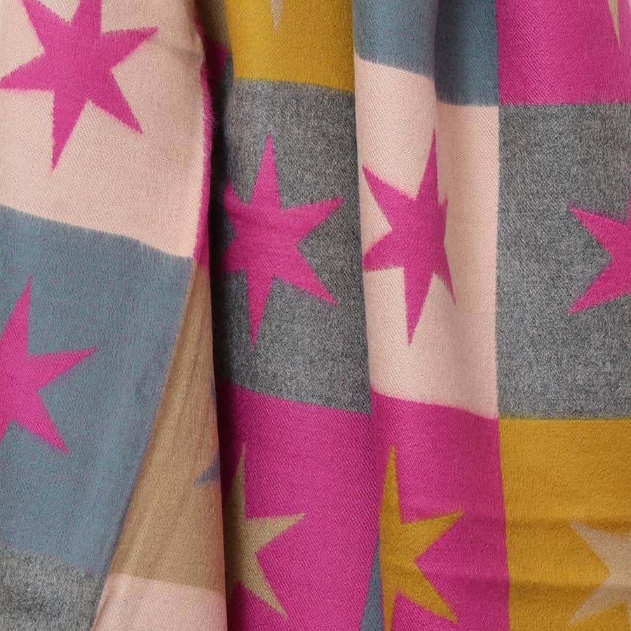 Close-up of pink stars on grey, mustard and pink jacquard blocks