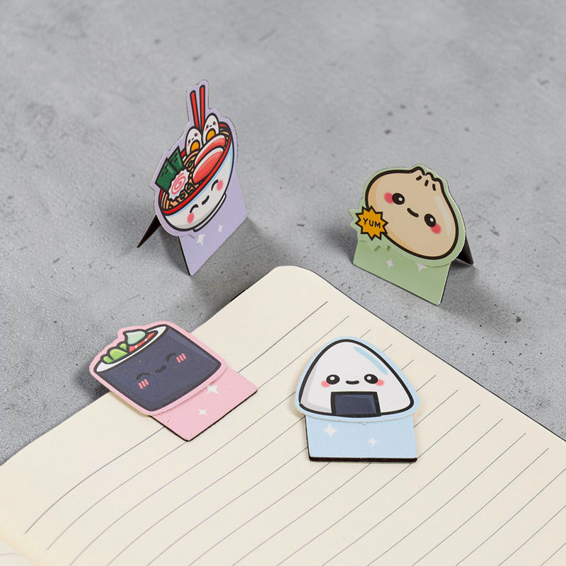 Ramen and onigiri bookmarks clipped onto a lined notepad