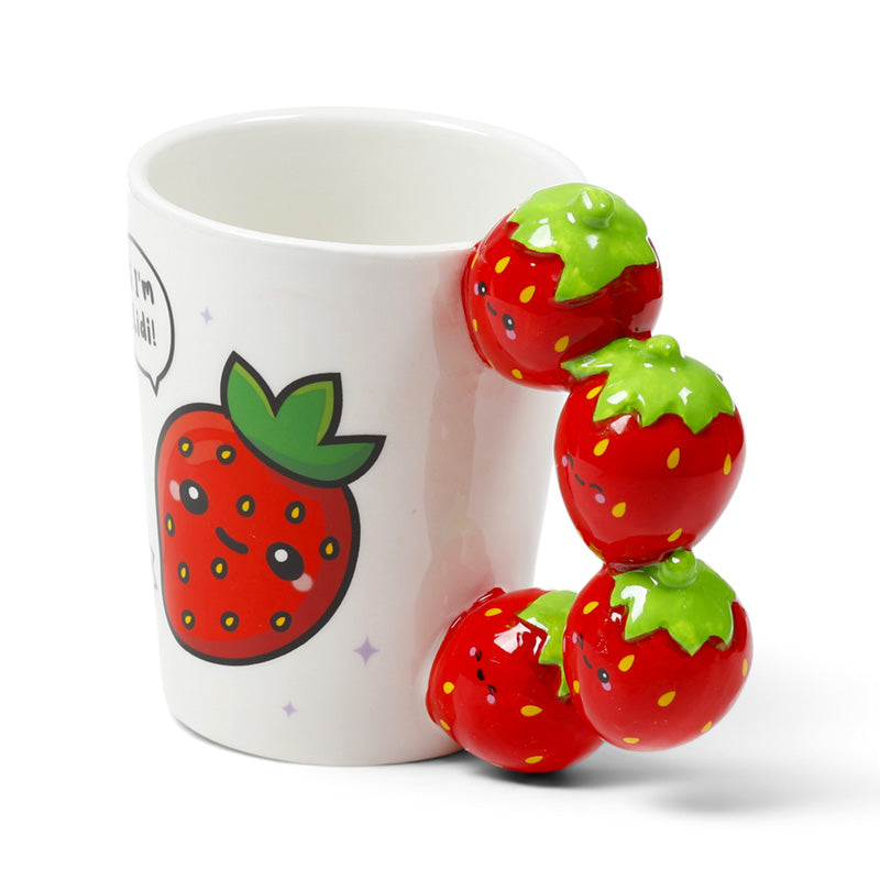 Close view of the sculpted strawberry handle on the ceramic mug