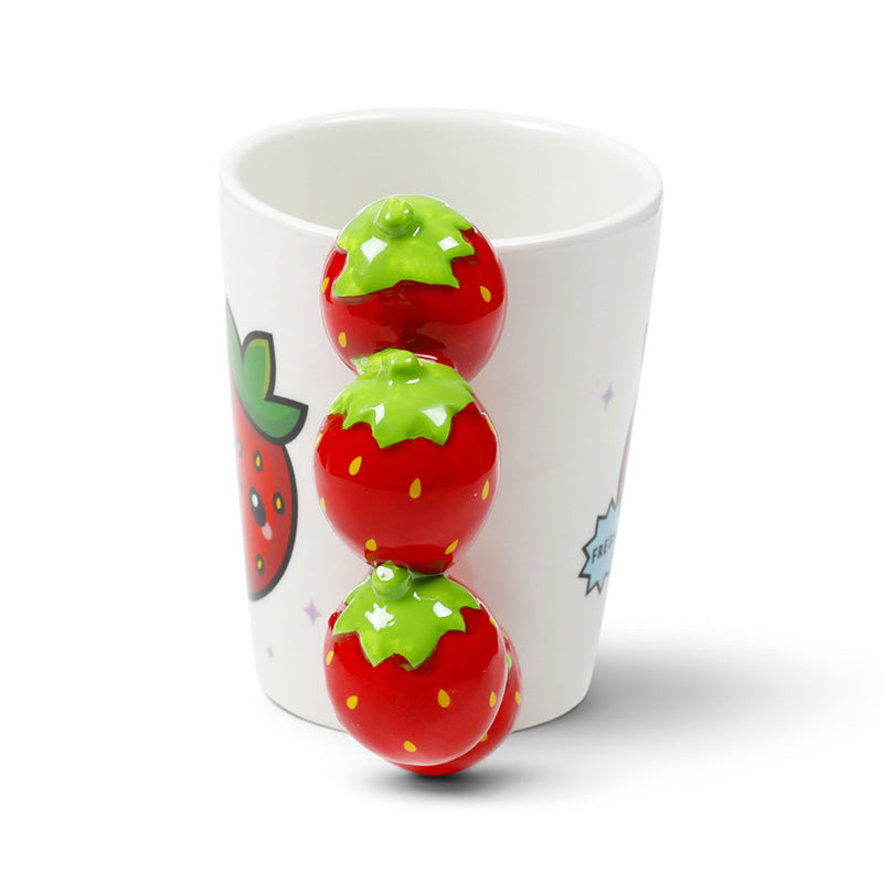Side view of the strawberry mug with berries running down the handle
