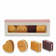Biscuit erasers set of 4 displayed in front of window gift box