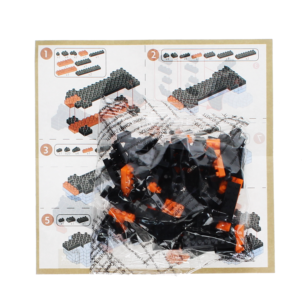 Instruction sheet and bagged micro bricks included in the sausage dog kit