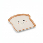 Bread slice ceramic snack plate with cute smiley face on white background