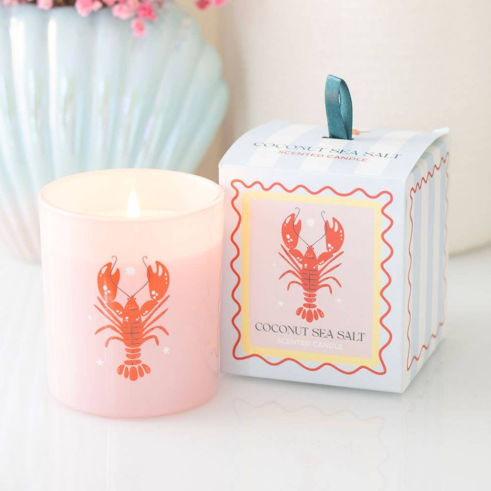 Glass candle in pastel striped box styled with coastal elements