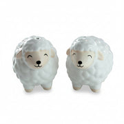 Ceramic sheep shakers showing happy closed eye faces and pink ears