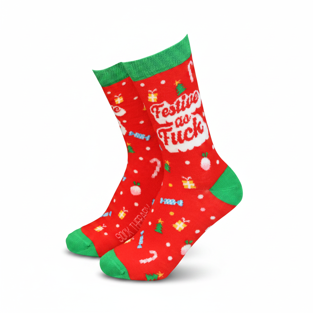 Red festive bamboo sock worn on a leg with green cuff and toe
