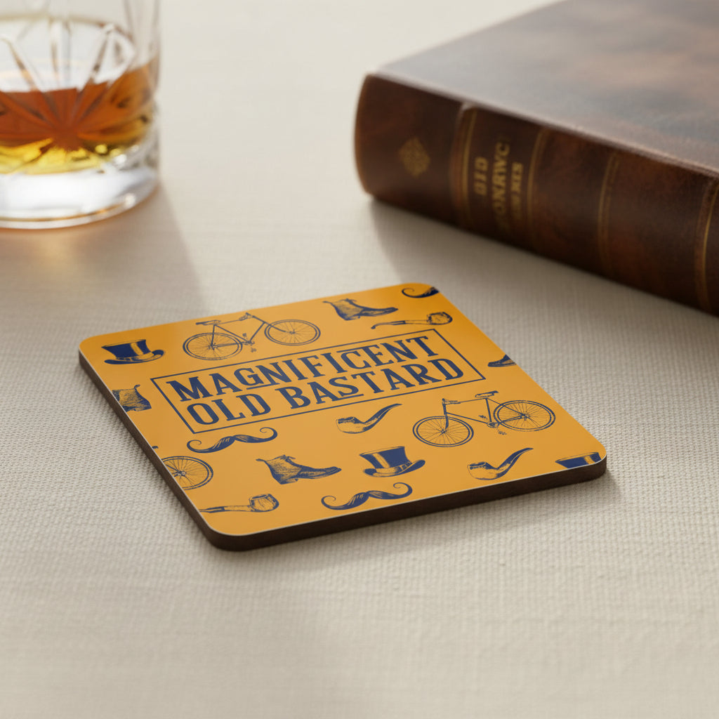 A square coaster with rounded corners featuring a vintage-style pattern of bicycles, mustaches, boots, and tobacco pipes on a bright orange background, with the text 'MAGNIFICENT OLD BASTARD' in dark blue block letters in the center.