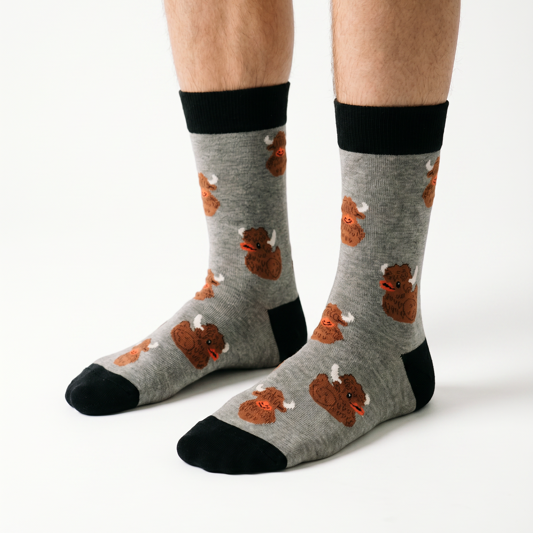 Highland coo and rubber duck socks worn, seen from the side