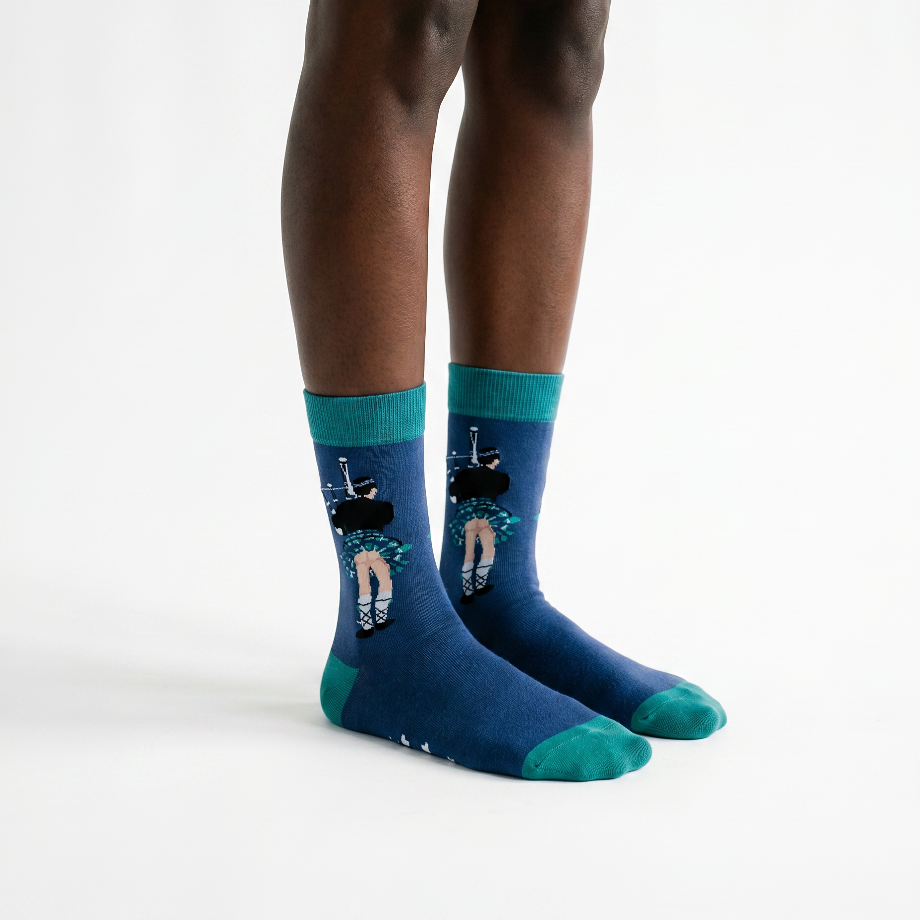 Blue kilt bum socks worn, showing the piper design on both legs