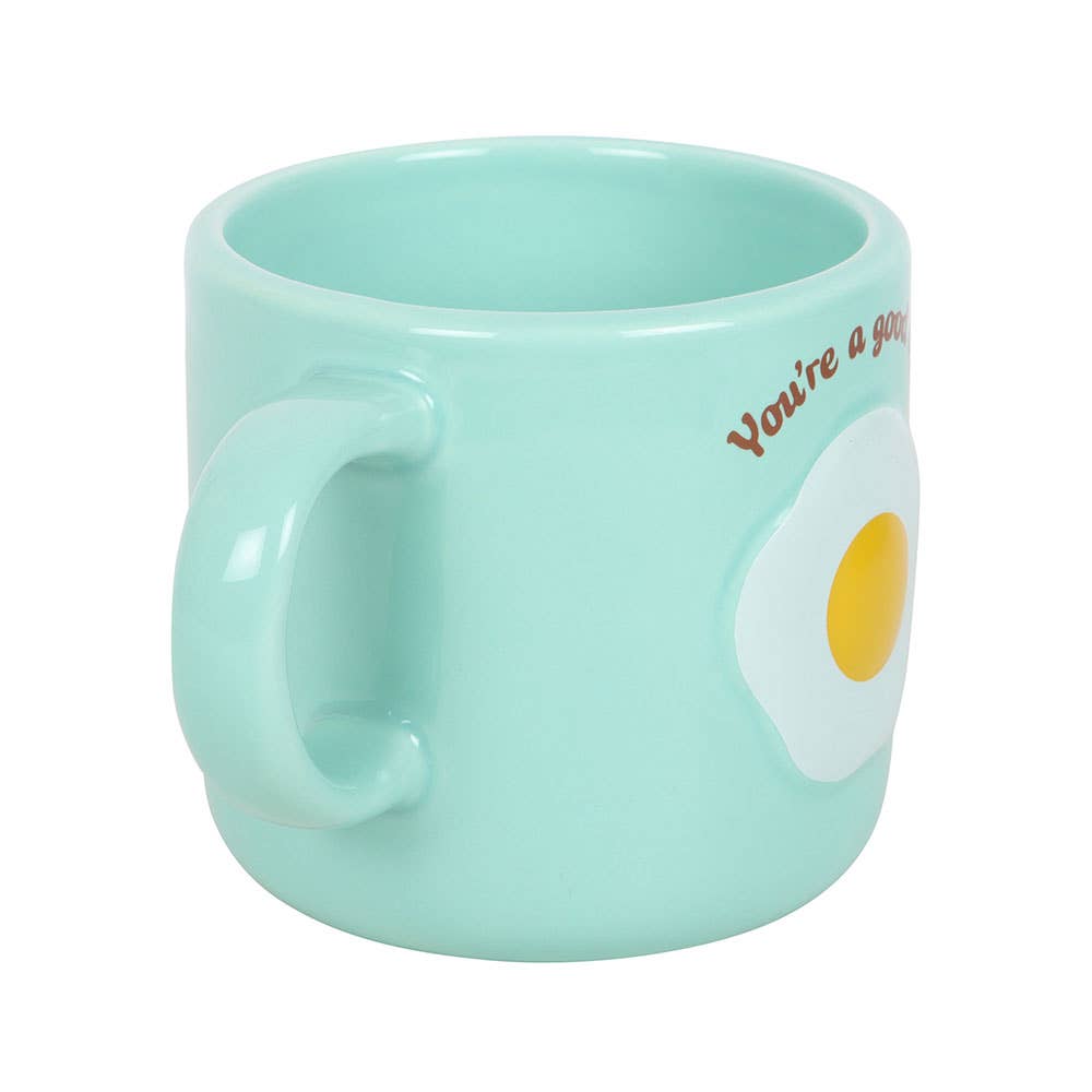 Side angle of mint green ceramic mug showing handle on white background