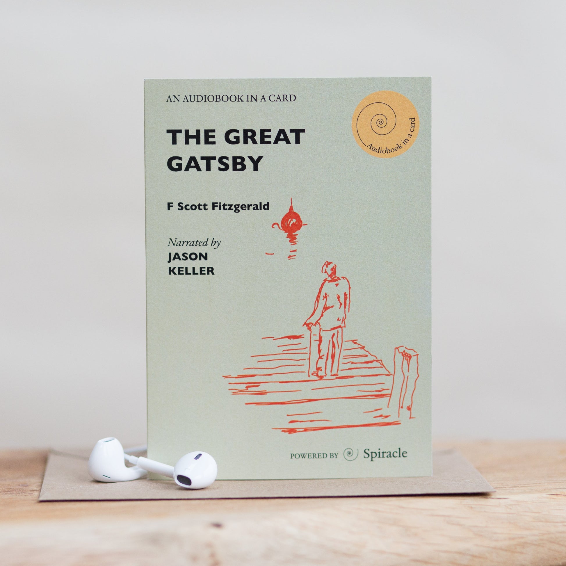 The Great Gatsby audiobook card styled on a surface with its envelope