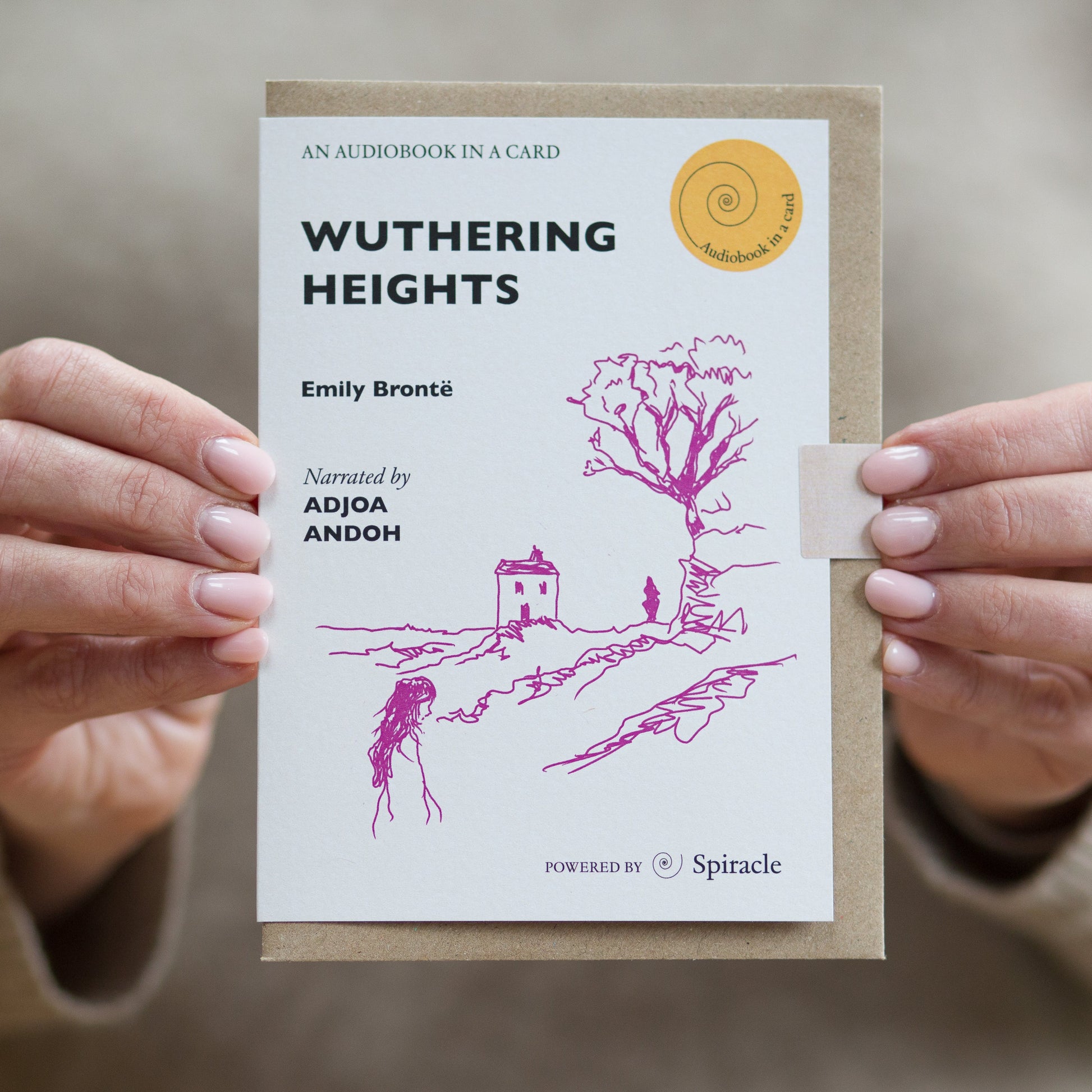 Hand holding the Wuthering Heights audiobook card to show its size