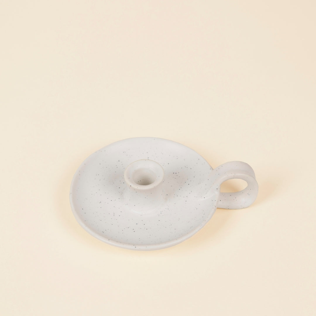 White Speckle Mini Candle Holder with Handle lifestyle base image on a cream background