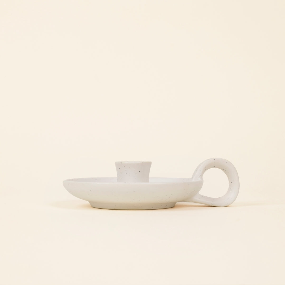 White Speckle Mini Candle Holder with Handle side view on a cream background