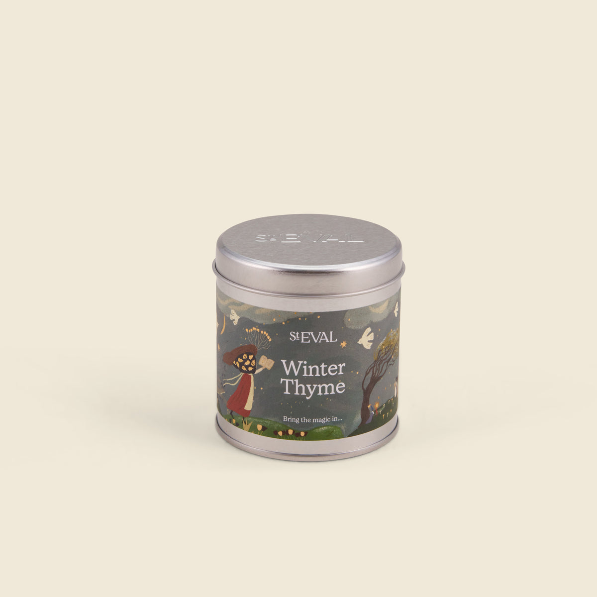 Winter Thyme Christmas Tin Candle shown from another angle on a cream background