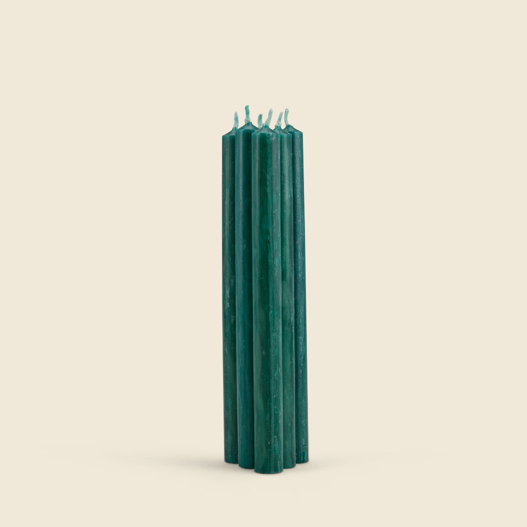 Winter Thyme Mini Festive Candles, Pack of 6 bundle of six green candles on a cream background