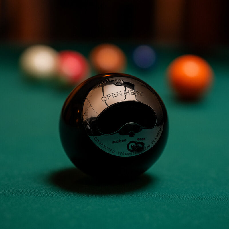 8 ball bottle opener on a green pool table with balls behind