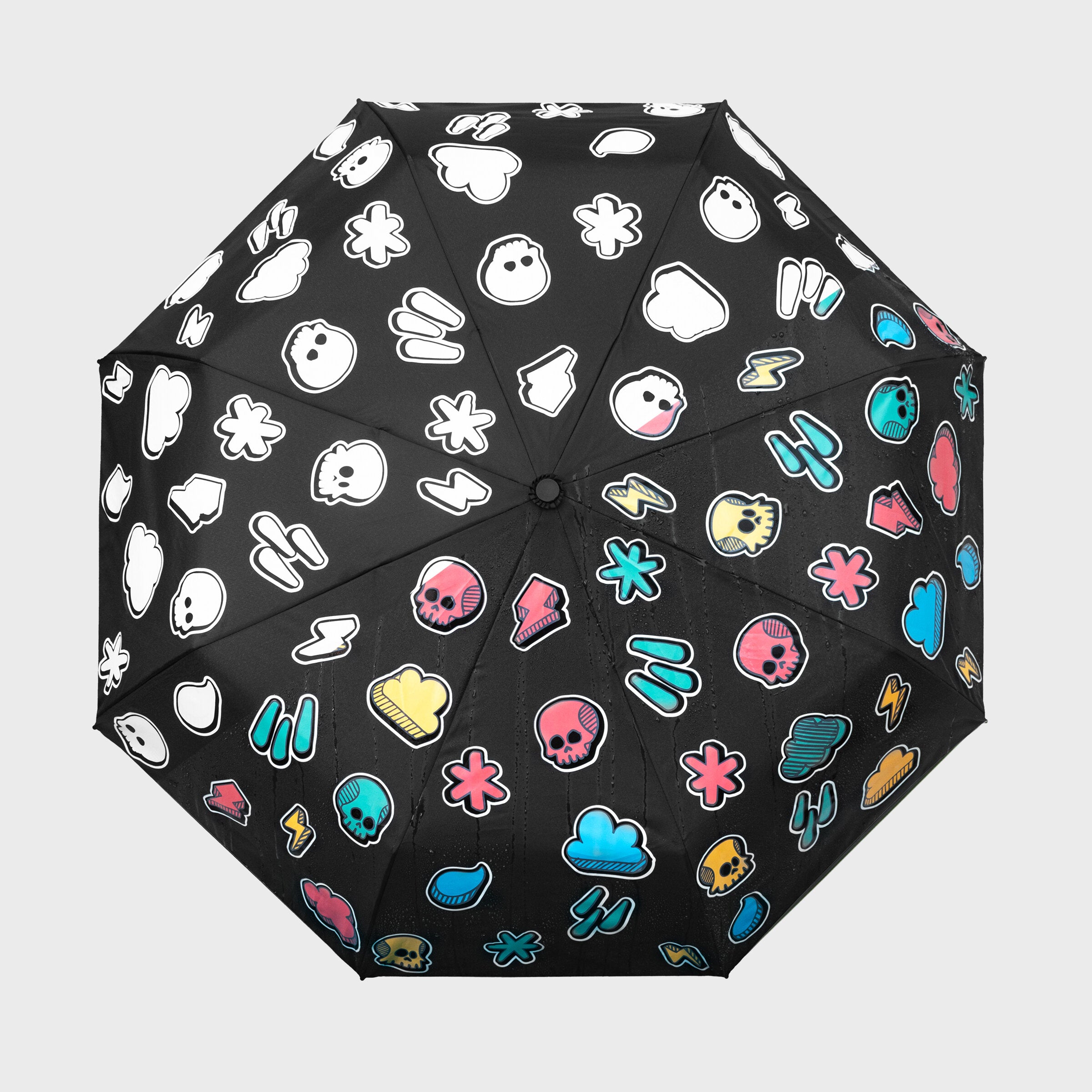 Weather pattern umbrella open from above showing white to colour transformation