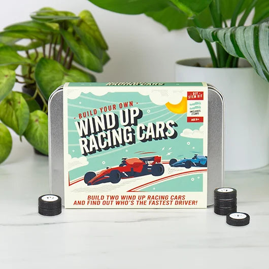 Wind up racing cars assembled from DIY kit on table