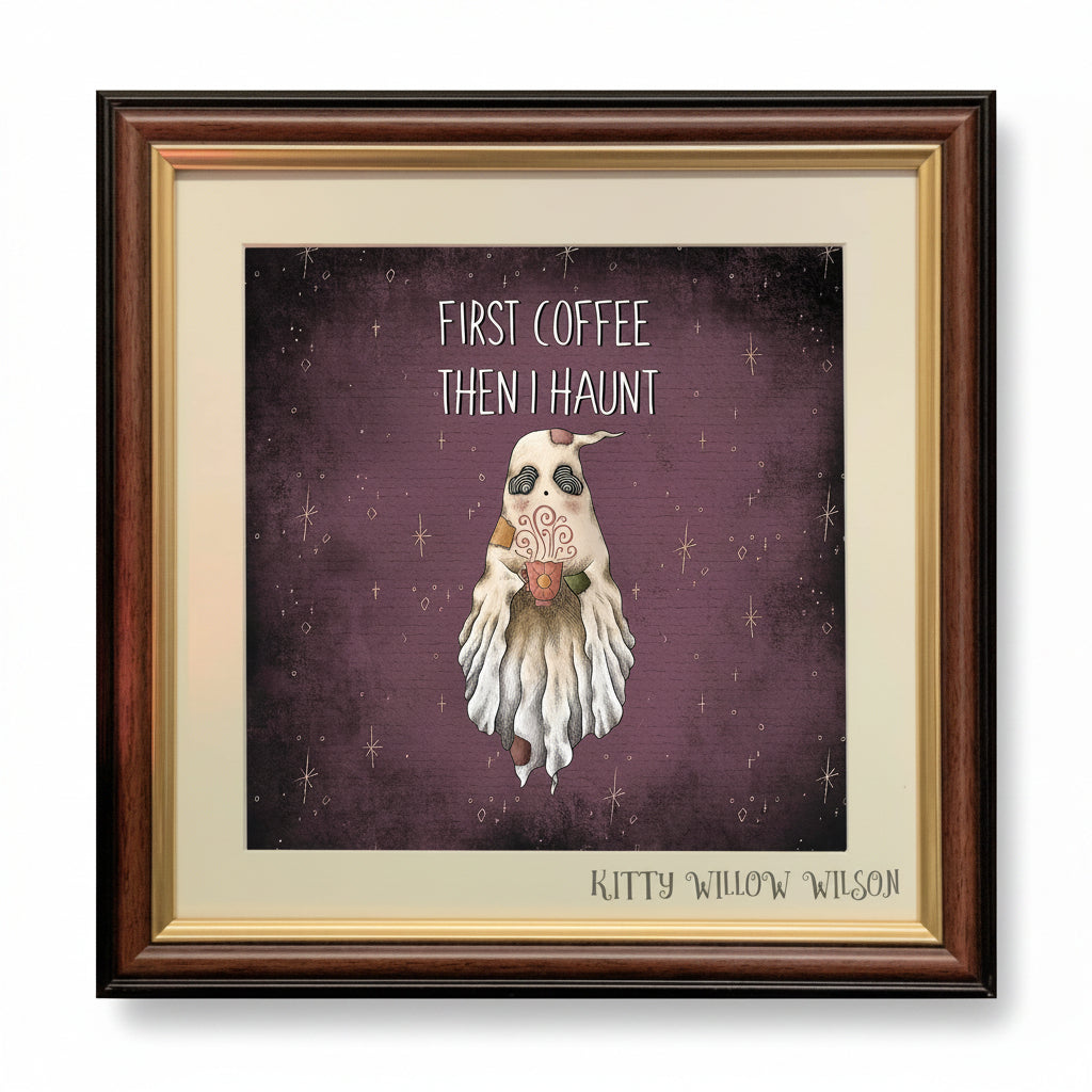 Framed art print featuring a ghost-like coffee cup character on a dark purple starry background with the text 'FIRST COFFEE THEN I HAUNT' and 'KITTY WILLOW WILSON' at the bottom.
