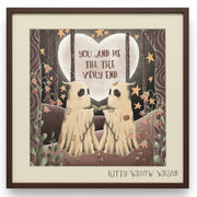 A framed art print featuring two ghost-like figures facing each other in front of a large heart-shaped moon with the text 'YOU AND ME TILL THE VERY END'. The artwork is signed 'KITTY WILLOW WISON' at the bottom.