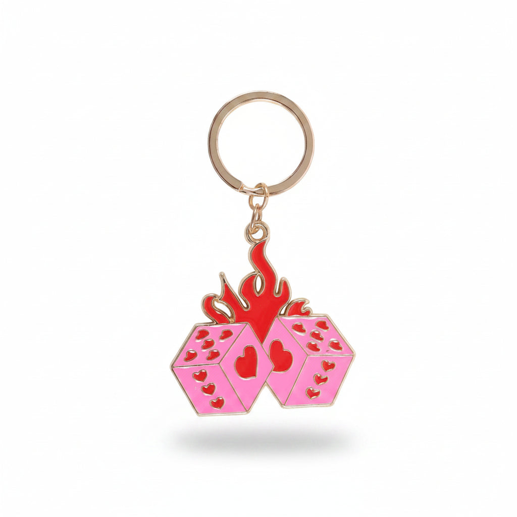 Y2K style flaming dice keyring on a roll of the dice card