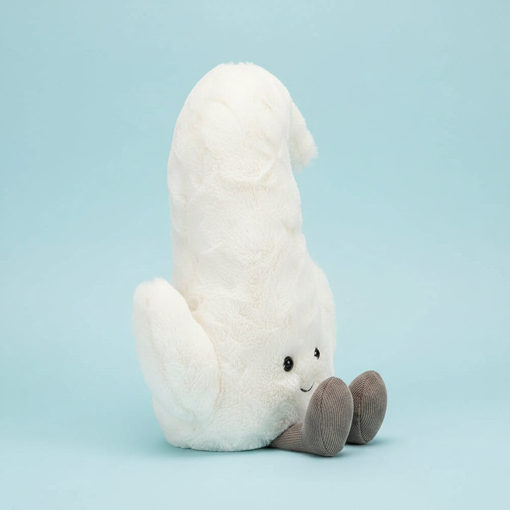 From the side Jellycat Amuseable Moon children’s soft toy. 