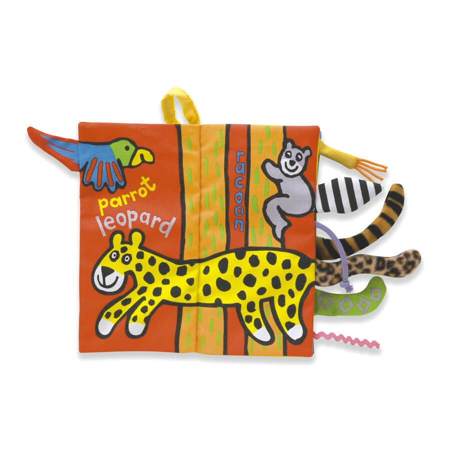 Inside the Jungle Tails children’s book from Jellycat. The page shows a picture of a cheetah and a parrot with their tails protruding from the edge of the soft book. 
