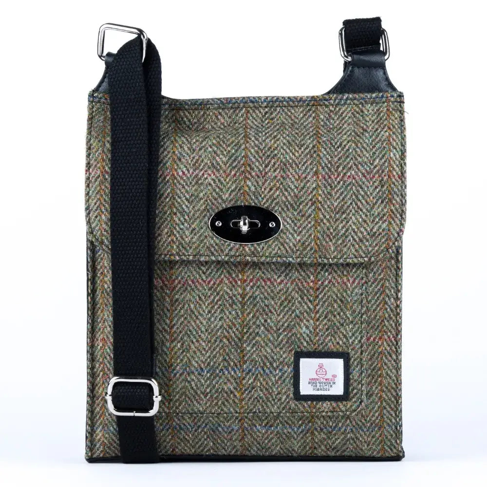 Brown and Green herringbone Maccessori Harris Tweed Satchel shoulder bag against a while background.